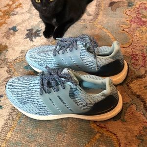 Adidas Ultra Boost torsion system running shoes.